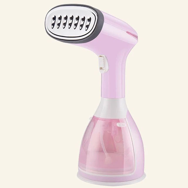 Plancha de vapor portátil color rosa ligera y compacta para viajes